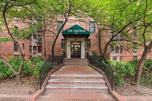 entrance to property with brick siding