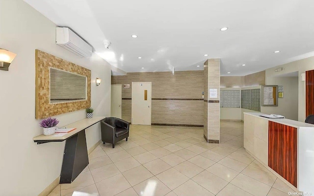 99-05 63rd Dr Unit 14R, Rego Park, NY 11374 - building lobby featuring recessed lighting and tile walls