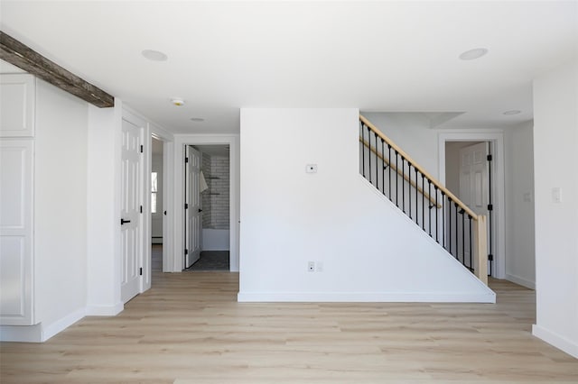 3 Holt Rd, Red Hook, NY 12571 - empty room featuring light wood finished floors, baseboards, and stairs