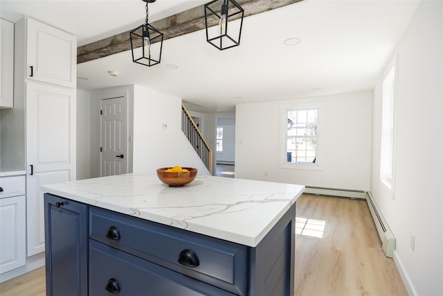 3 Holt Rd, Red Hook, NY 12571 - kitchen featuring blue cabinets, a baseboard radiator, and light wood-style flooring