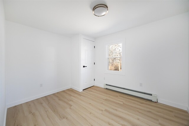 3 Holt Rd, Red Hook, NY 12571 - unfurnished room with a baseboard radiator, wood finished floors, and baseboards