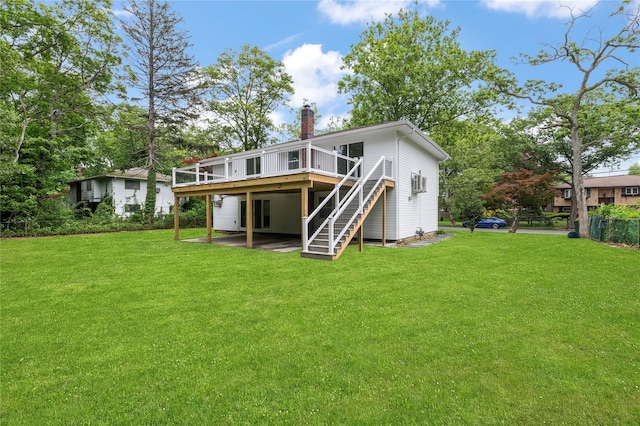 155 Brooklyn Ave, Huntington, NY 11743 - back of house featuring a wooden deck, stairs, a chimney, and a yard