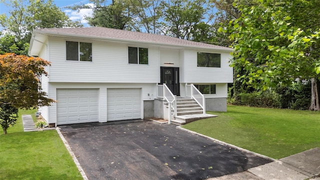 155 Brooklyn Ave, Huntington, NY 11743 - bi-level home featuring driveway, a front yard, a garage, and roof with shingles