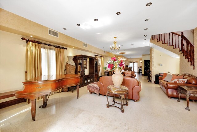 186-31 Radnor Rd, Jamaica Estates, NY 11432 - living room with a chandelier, stairs, and recessed lighting