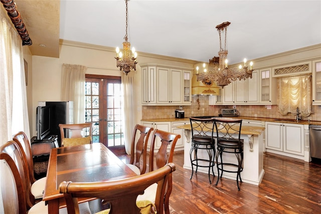 186-31 Radnor Rd, Jamaica Estates, NY 11432 - dining room with a chandelier, french doors, dark wood-type flooring, and ornamental molding