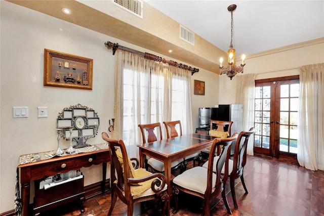 186-31 Radnor Rd, Jamaica Estates, NY 11432 - dining area with french doors, a chandelier, healthy amount of natural light, dark tile patterned flooring, and recessed lighting