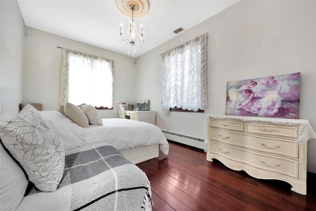186-31 Radnor Rd, Jamaica Estates, NY 11432 - bedroom with baseboard heating, a chandelier, and hardwood / wood-style flooring