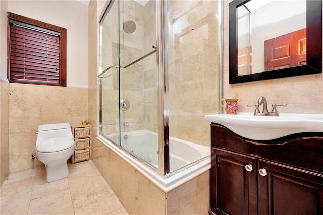 186-31 Radnor Rd, Jamaica Estates, NY 11432 - bathroom featuring tile walls, tiled shower / bath combo, toilet, and vanity