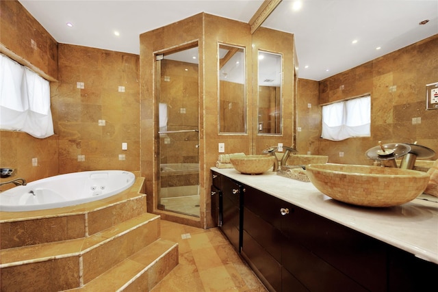 186-31 Radnor Rd, Jamaica Estates, NY 11432 - full bathroom with tile walls, a shower stall, a jetted tub, and double vanity