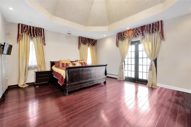 186-31 Radnor Rd, Jamaica Estates, NY 11432 - bedroom featuring a baseboard heating unit, wood finished floors, baseboards, and recessed lighting
