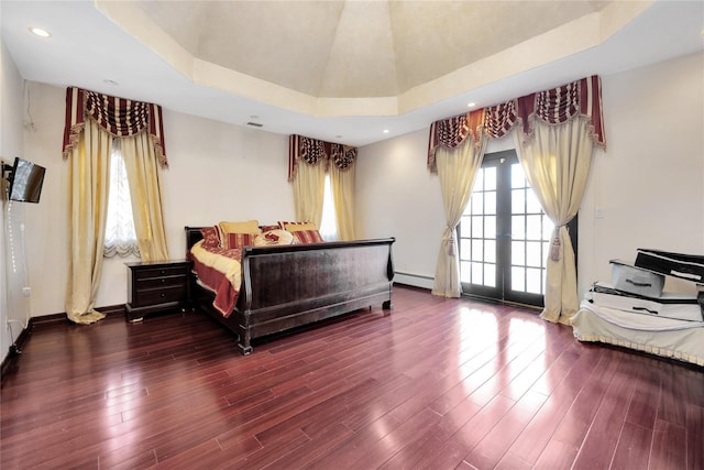 186-31 Radnor Rd, Jamaica Estates, NY 11432 - bedroom with a baseboard radiator, wood finished floors, baseboards, recessed lighting, and a raised ceiling
