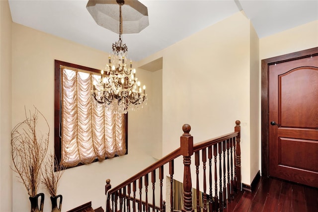 186-31 Radnor Rd, Jamaica Estates, NY 11432 - staircase with wood finished floors, a chandelier, and baseboards