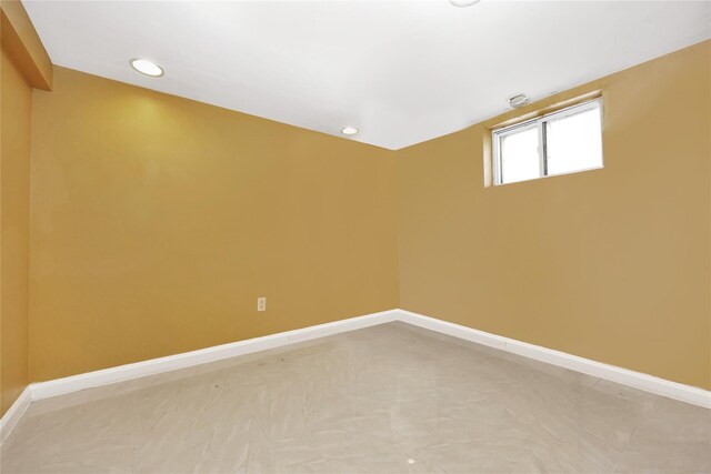 186-31 Radnor Rd, Jamaica Estates, NY 11432 - unfurnished room featuring baseboards and recessed lighting