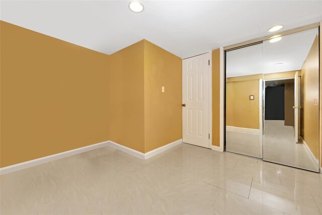 186-31 Radnor Rd, Jamaica Estates, NY 11432 - bonus room with baseboards and recessed lighting