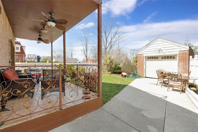 186-31 Radnor Rd, Jamaica Estates, NY 11432 - view of patio / terrace featuring an outbuilding, a ceiling fan, and a detached garage