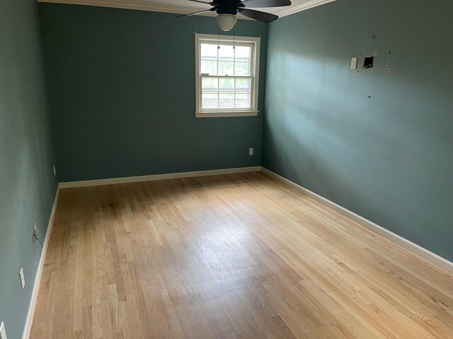 7 Beaver Dr, Locust Valley, NY 11560 - empty room featuring a ceiling fan, wood finished floors, baseboards, and crown molding