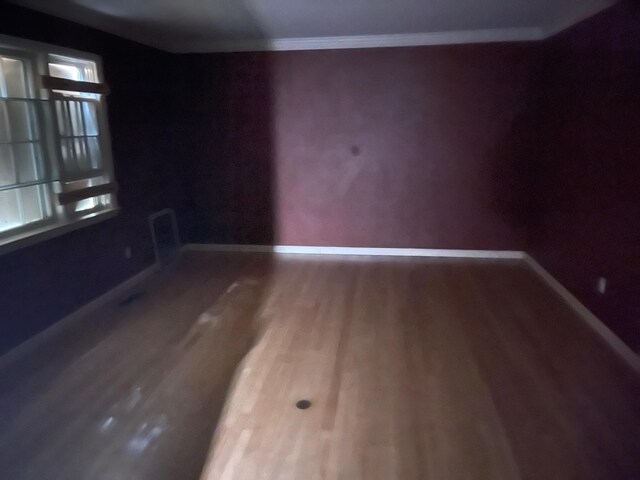 7 Beaver Dr, Locust Valley, NY 11560 - spare room featuring baseboards, wood finished floors, and crown molding