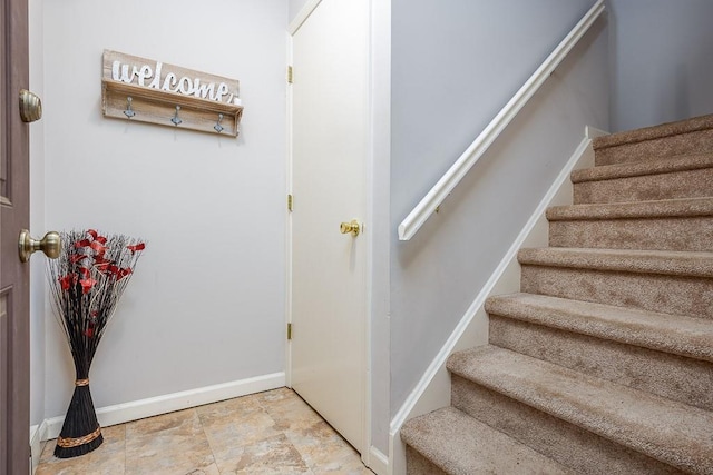 71 Frank Ct, Monroe, NY 10950 - stairway with baseboards and stone finish floors