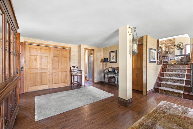 24 Brushwood Ct, East Islip, NY 11730 - entrance foyer featuring stairs and dark wood-type flooring