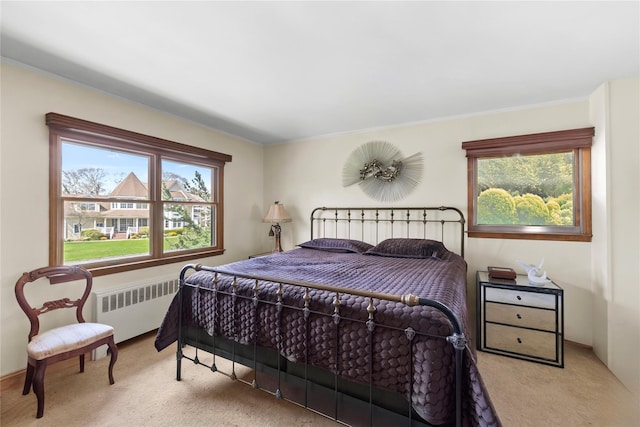 24 Brushwood Ct, East Islip, NY 11730 - bedroom featuring radiator, carpet flooring, and ornamental molding