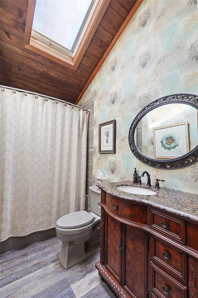 24 Brushwood Ct, East Islip, NY 11730 - bathroom featuring vaulted ceiling, wood ceiling, vanity, a skylight, and wood finished floors