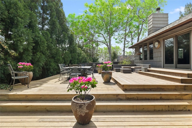 24 Brushwood Ct, East Islip, NY 11730 - deck featuring outdoor dining space