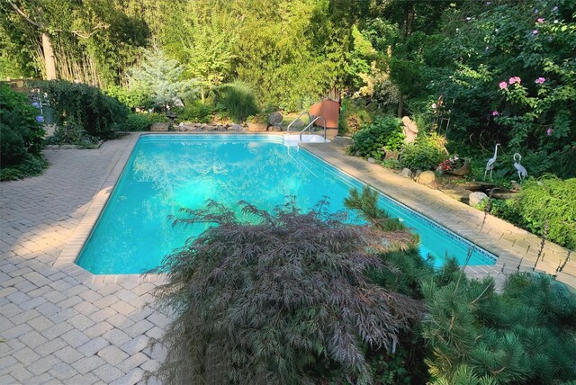 24 Brushwood Ct, East Islip, NY 11730 - outdoor pool with a patio area