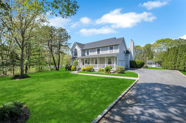 7 Ellbridge Ct, South Setauket, NY 11720 - view of front of home featuring a porch, a chimney, driveway, a garage, and a front lawn