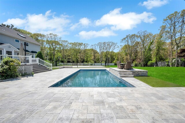 7 Ellbridge Ct, South Setauket, NY 11720 - outdoor pool featuring a patio, a wooden deck, and outdoor dining area
