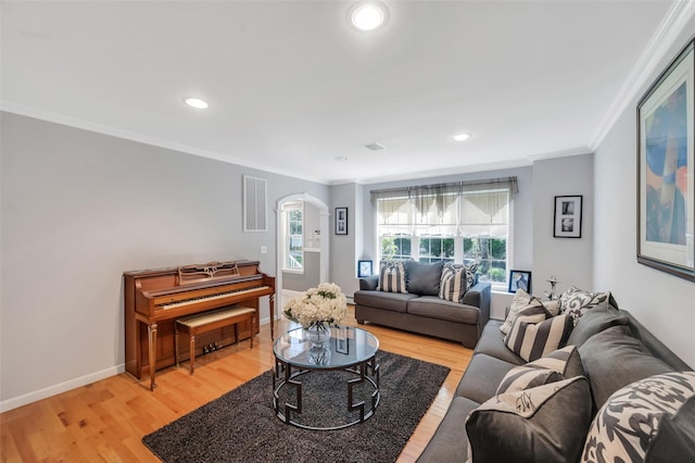 7 Ellbridge Ct, South Setauket, NY 11720 - living room with arched walkways, crown molding, light wood-style floors, baseboards, and recessed lighting