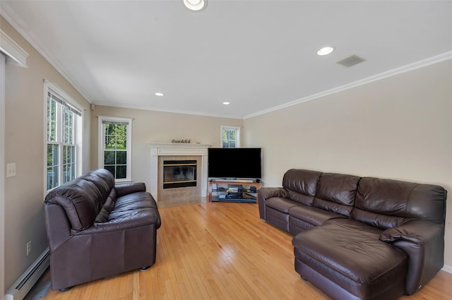 7 Ellbridge Ct, South Setauket, NY 11720 - living area featuring a baseboard heating unit, a high end fireplace, light wood finished floors, recessed lighting, and crown molding