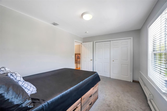 7 Ellbridge Ct, South Setauket, NY 11720 - bedroom featuring carpet flooring, a closet, and a baseboard heating unit