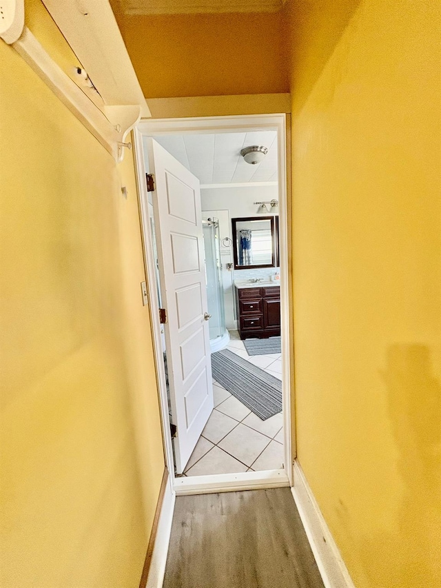 hallway featuring baseboards