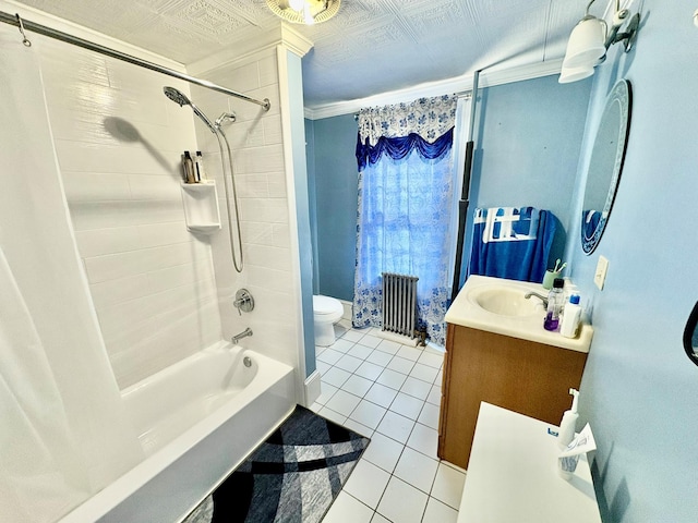 full bathroom with toilet, tile patterned floors, radiator heating unit, vanity, and shower / tub combo