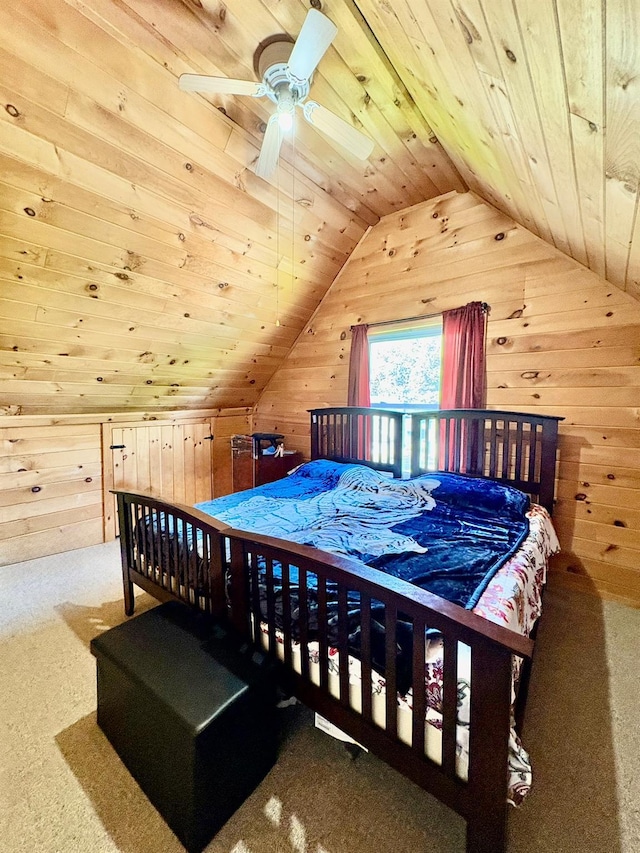 bedroom featuring wooden walls, carpet, vaulted ceiling, and wooden ceiling