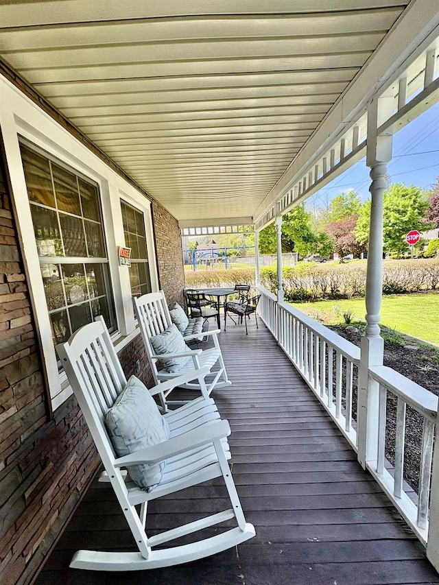 wooden deck featuring covered porch