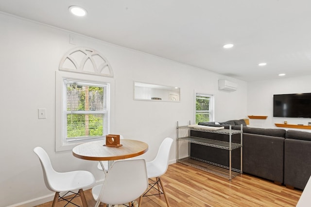 8 N Railroad Ave, Jamesport, NY 11901 - dining room featuring a wall unit AC, light wood-style floors, recessed lighting, and baseboards