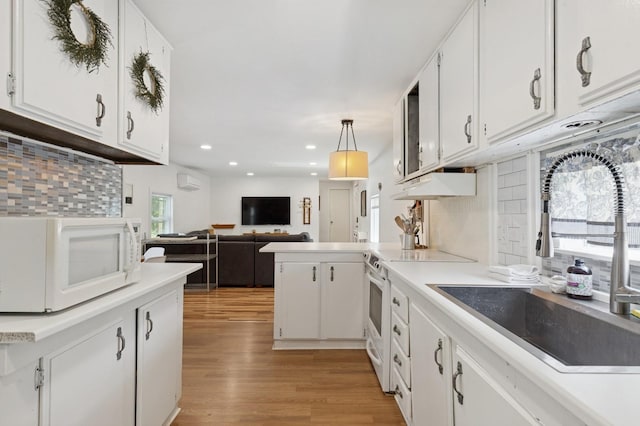 8 N Railroad Ave, Jamesport, NY 11901 - kitchen with white appliances, a sink, white cabinetry, tasteful backsplash, and recessed lighting
