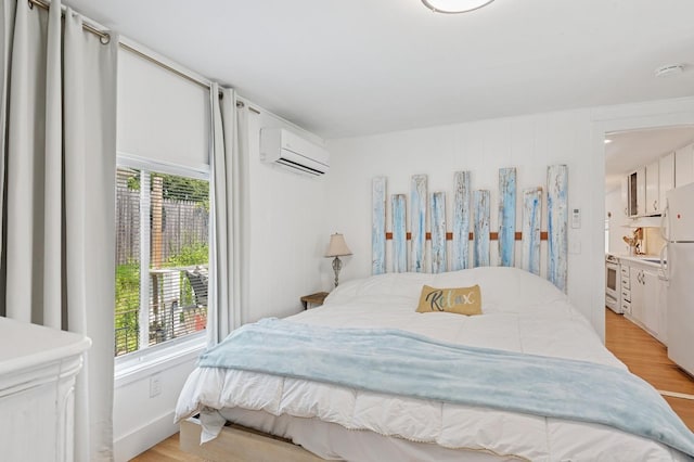 8 N Railroad Ave, Jamesport, NY 11901 - bedroom featuring a wall unit AC, multiple windows, and light wood-type flooring
