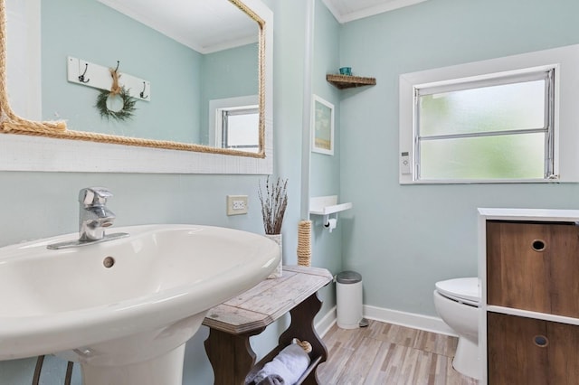 8 N Railroad Ave, Jamesport, NY 11901 - bathroom featuring a sink, toilet, baseboards, and wood finished floors