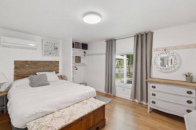 8 N Railroad Ave, Jamesport, NY 11901 - bedroom featuring an AC wall unit and light wood-style flooring
