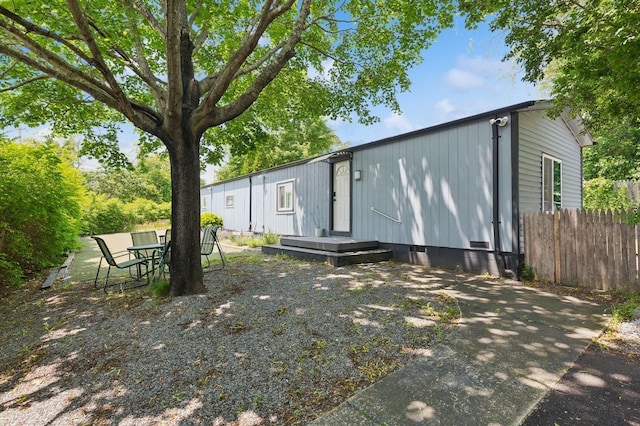 8 N Railroad Ave, Jamesport, NY 11901 - rear view of property with crawl space and outdoor dining area