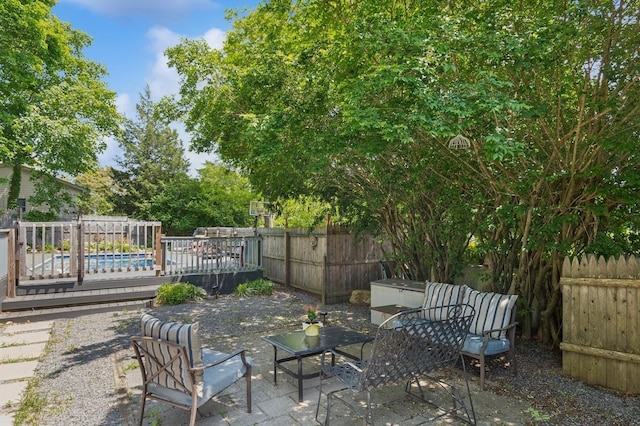 8 N Railroad Ave, Jamesport, NY 11901 - fenced backyard featuring a patio and a deck