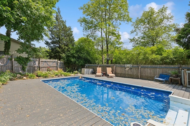 8 N Railroad Ave, Jamesport, NY 11901 - view of pool featuring a wooden deck and a fenced backyard