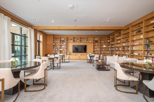 living room featuring carpet flooring and built in shelves