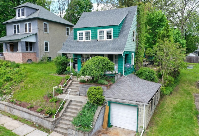24 Park St, Kingston, NY 12401 - view of front of house featuring a porch, a front yard, a garage, stairway, and a shingled roof