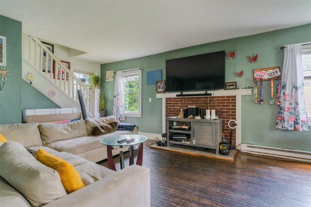 24 Park St, Kingston, NY 12401 - living area with stairway, wood finished floors, a baseboard radiator, and baseboards