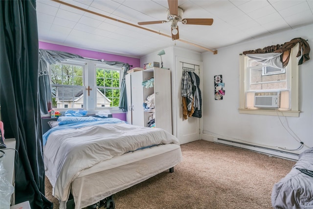 24 Park St, Kingston, NY 12401 - bedroom featuring baseboard heating, cooling unit, carpet floors, ceiling fan, and a closet