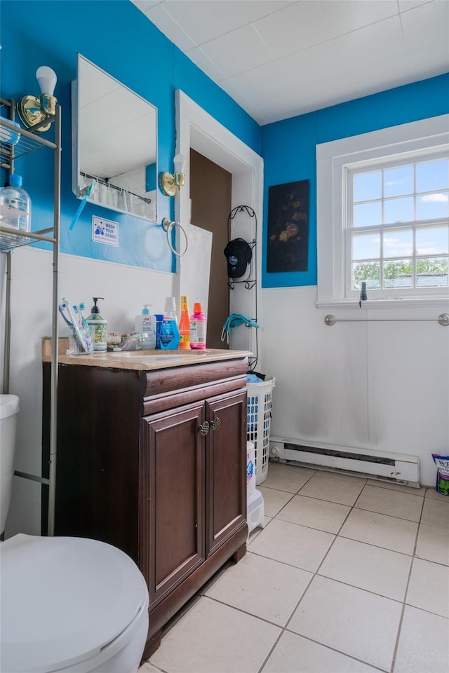24 Park St, Kingston, NY 12401 - bathroom featuring a baseboard radiator, toilet, tile patterned floors, and vanity