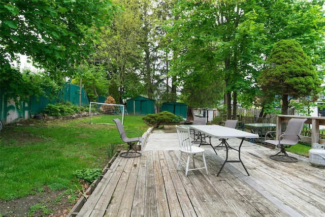 24 Park St, Kingston, NY 12401 - deck with a storage shed, an outbuilding, and outdoor dining space